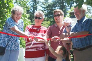The ribbon-cutting duties were handled by Lynn Oborne, Shirley Sedore, Matt Mertins and his children, and Central Frontenac Mayor Ron Higgins.